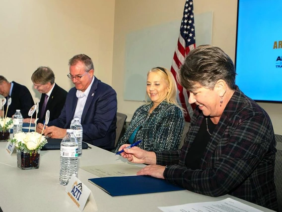 Engineering deans (left to right) Charles Chadwell of NAU; Kyle Squires of ASU; David W. Hahn of the U of A; Karla Petty, FHWA Division Administrator for Arizona; and Jennifer Toth, ADOT director, sign a letter of understanding for AZTI.