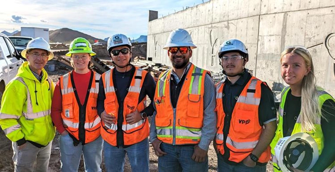 Dean Papajohn, left, and students studying construction engineering management attend a site visit hosted by Granite Construction.