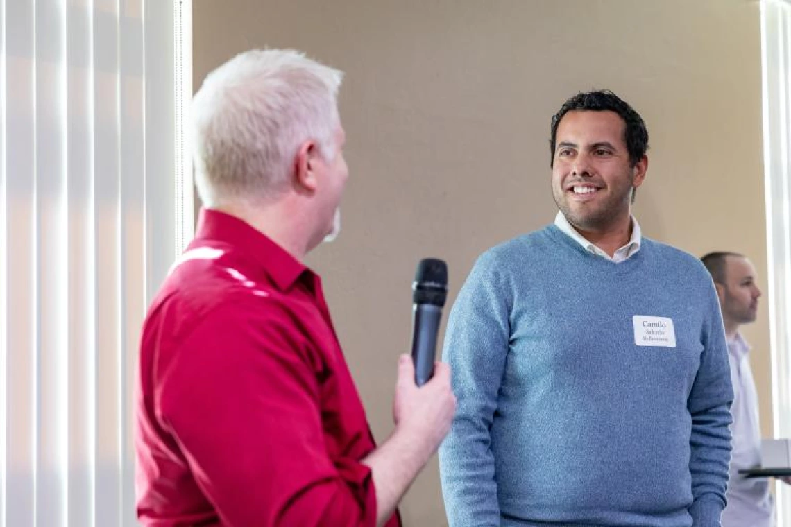 Dominic Boccelli congratulates outstanding graduate senior Camilo Salcedo