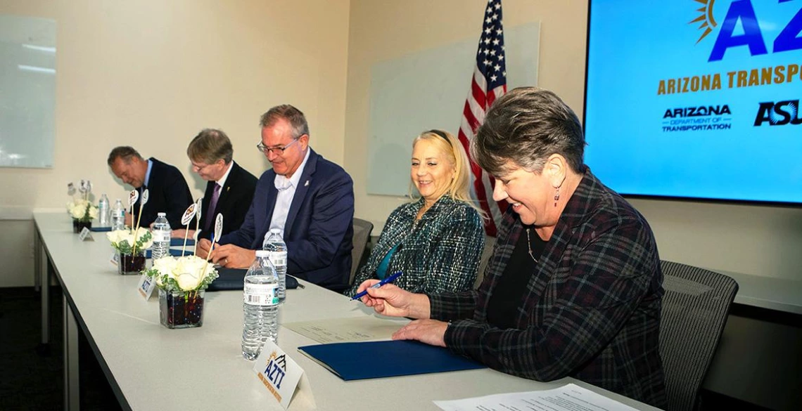 Engineering deans (left to right) Charles Chadwell of NAU; Kyle Squires of ASU; David W. Hahn of the U of A; Karla Petty, FHWA Division Administrator for Arizona; and Jennifer Toth, ADOT director, sign a letter of understanding for AZTI.