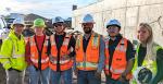 Dean Papajohn, left, and students studying construction engineering management attend a site visit hosted by Granite Construction.