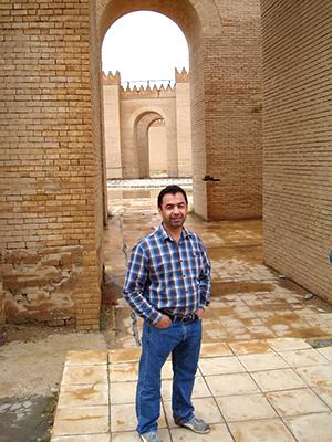 A man stands in a sandstone fortress