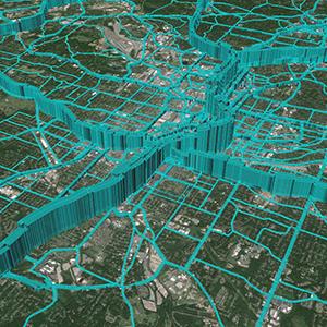 Detail of a simulation program's output, with blue lines of varying heights superimposed on a satellite map of a city