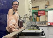 Melanie Macioce working at a circular saw