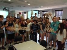 Participants of the Summer Engineering Academy pose with their Popcicle stick bridges.