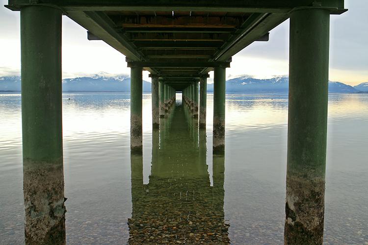 A view under a pier, with supports on either side
