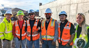 Dean Papajohn, left, and students studying construction engineering management attend a site visit hosted by Granite Construction.