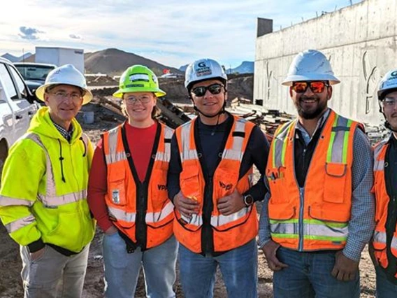 Dean Papajohn, left, and students studying construction engineering management attend a site visit hosted by Granite Construction.