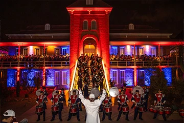 night time, marching band in front of Univ. of Arizona Old Main building